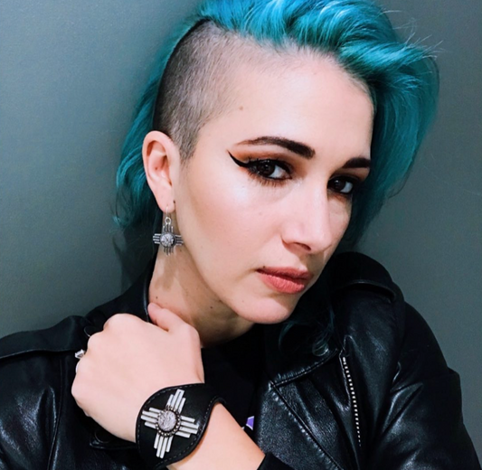 Ashley Reeve at the Boston Garden backstage wearing Shane Casias Jewelry