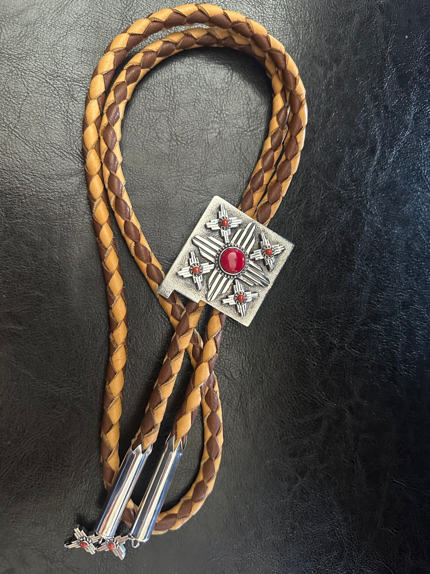 Shane Casias handmade sterling silver Zia bolo tie with Mediterranean red coral and Rosarita stone centerpiece